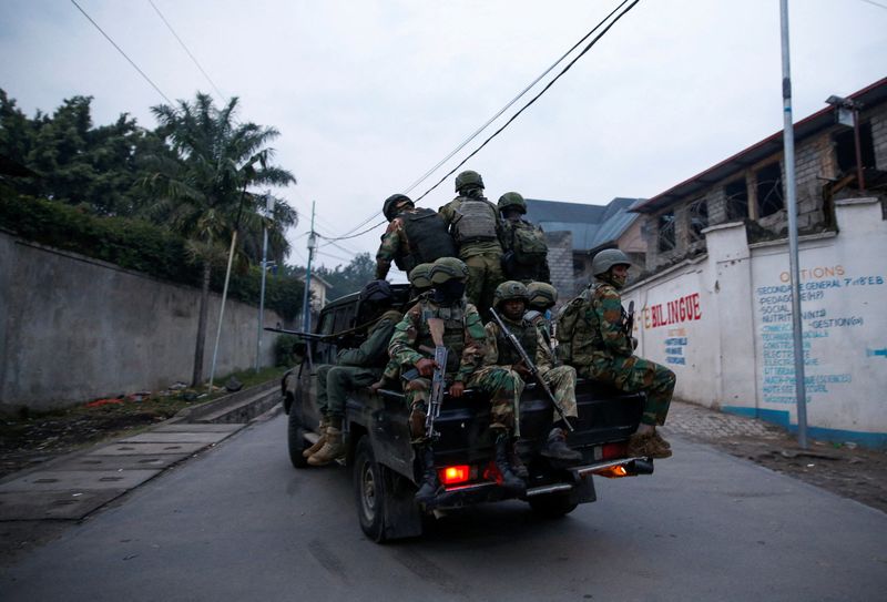 FILE PHOTO: Members of the M23 rebel group ride on a pickup truck as they leave their position for patrols amid conflict between them and the Armed Forces of the Democratic Republic of the Congo (FARDC), in Goma, eastern Democratic Republic of the Congo, January 29, 2025. REUTERS/Stringer/File Photo