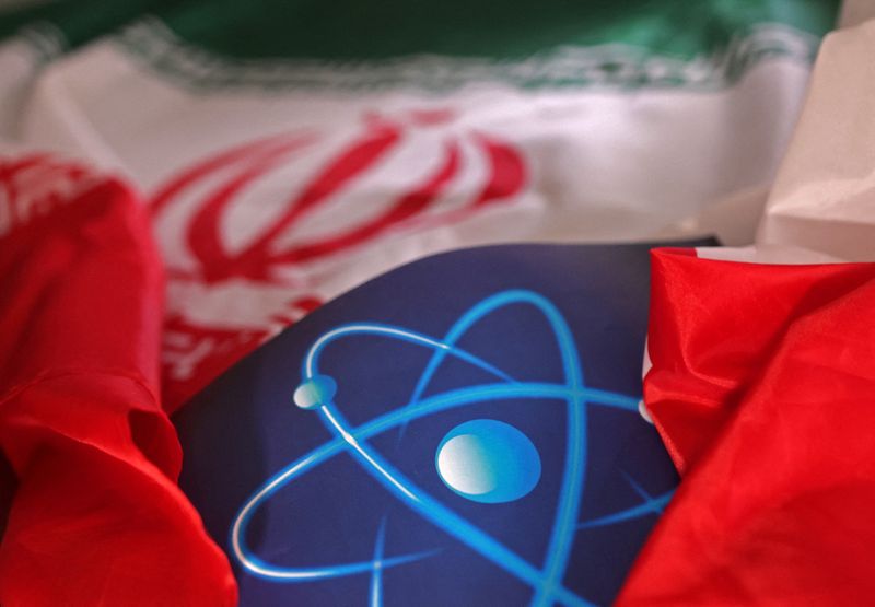 FILE PHOTO: Atomic symbol and Iranian flag are seen in this illustration taken September 8, 2022. REUTERS/Dado Ruvic/Illustration/File Photo