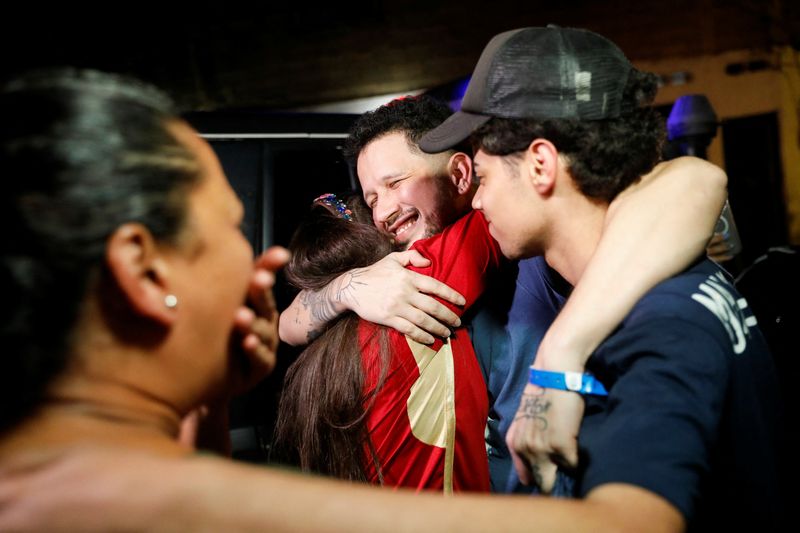 Arturo Suarez, who was held for months in an El Salvador prison after the U.S. alleged he was a member of the Tren de Aragua gang, embraces family members after his release, in Caracas, Venezuela July 22, 2025. REUTERS/Leonardo Fernandez Viloria