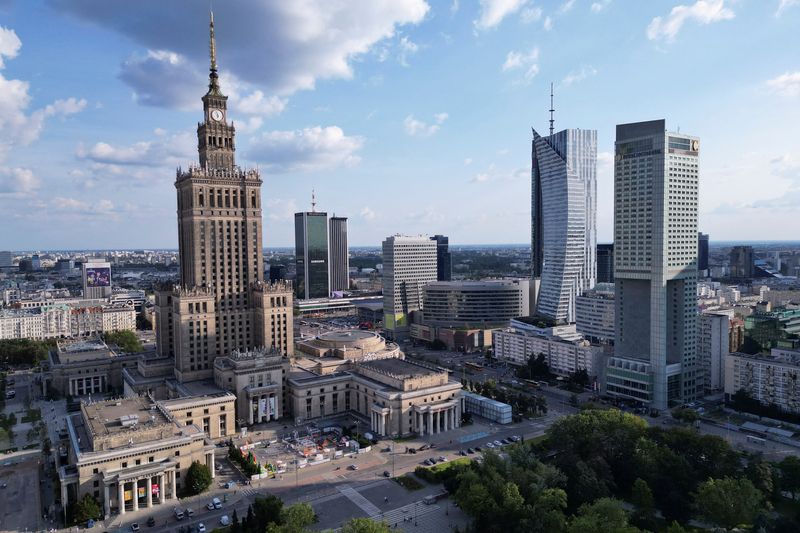 A drone view shows Warsaw’s skyline with modern skyscrapers and the Palace of Culture and Science in Warsaw, Poland, July 18, 2025. REUTERS/Kuba Stezycki