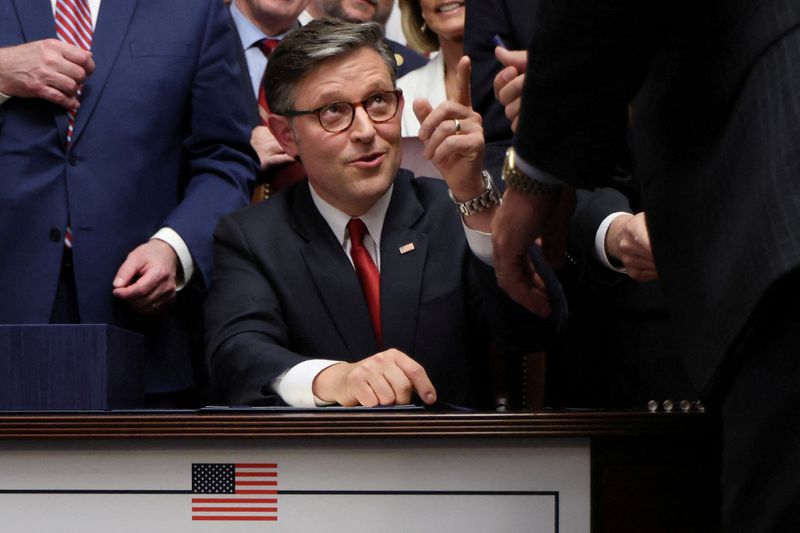 FILE PHOTO: U.S. House of Representatives Speaker Mike Johnson reacts following the signing of U.S. President Donald Trump's sweeping spending and tax bill, on Capitol Hill in Washington, D.C., U.S., July 3, 2025. REUTERS/Jonathan Ernst/File Photo