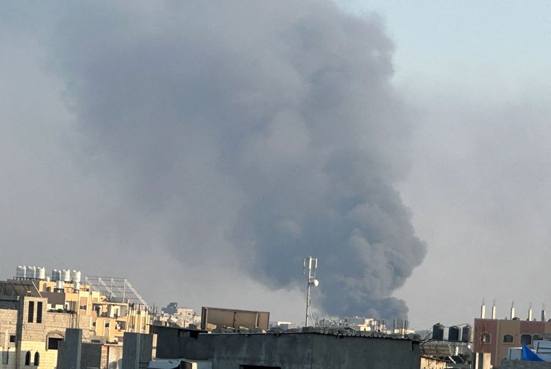 Smoke rises during Israeli strikes amid the Israeli military operation in Deir Al-Balah, in the central Gaza Strip, July 21, 2025. REUTERS/Hatem Khaled/File Photo
