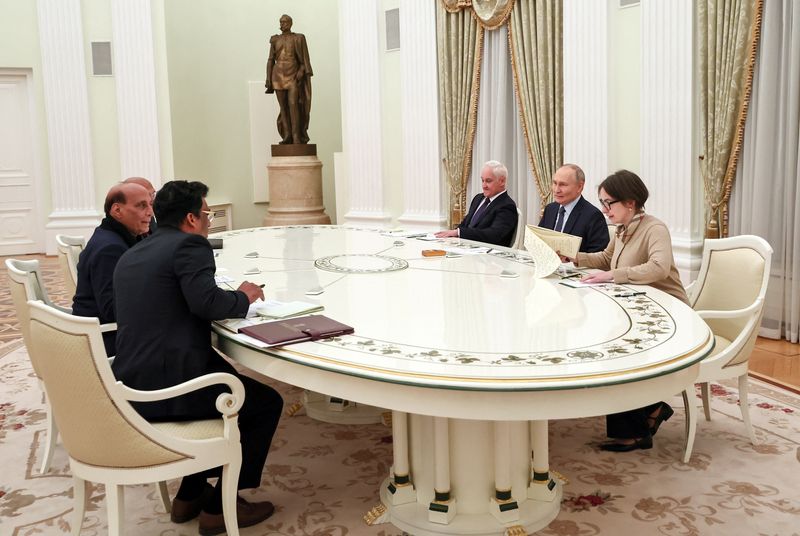 Officials, including Russia's President Vladimir Putin, Defence Minister Andrei Belousov and India's Defence Minister Rajnath Singh, attend a meeting in Moscow, Russia December 10, 2024. Sputnik/Sofya Sandurskaya/Pool via REUTERS/File Photo