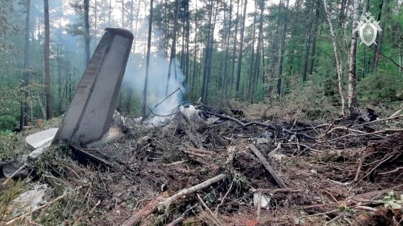 FILE PHOTO: A view shows the debris of an Angara Airlines An-24 passenger aircraft at the crash site near Tynda in the Amur Region, Russia July 24, 2025, in this still image taken from video. Russian Investigative Committee/Handout via REUTERS/File Photo