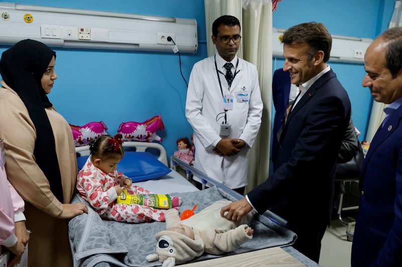 Egypt's President Abdel Fattah al-Sisi and French President Emmanuel Macron visit a ward for Palestinian patients at El Arish Hospital, close to the border with the Gaza Strip, in Arish, Egypt April 8, 2025.  Ludovic Marin/Pool via REUTERS