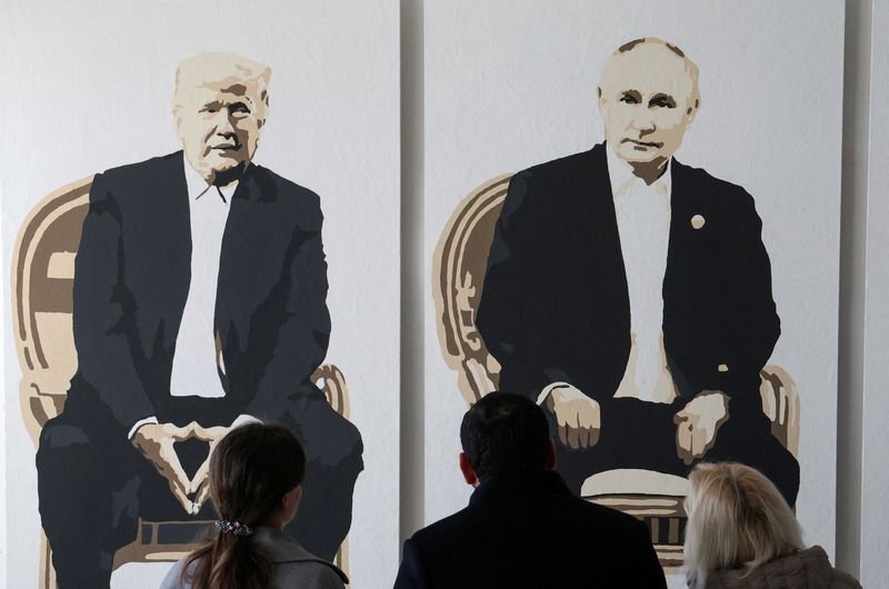 FILE PHOTO: Visitors stand in front of a a fragment of an artwork depicting U.S. President Donald Trump and Russian President Vladimir Putin at an exhibition, which is called "Yalta 2.0" and opened to make a reference to the 1945 Yalta Conference, at an art gallery in Livadia park in Yalta, Crimea, February 8, 2025. REUTERS/Alexey Pavlishak/File Photo