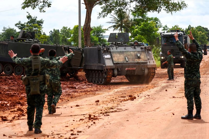 FILE PHOTO: Armoured personnel carriers (APC) are seen on a road near Thailand-Cambodia's border in Sisaket province, the day after the leaders of Cambodia and Thailand agreed to a ceasefire on Monday in a bid to bring an end to their deadliest conflict in more than a decade and ahead of military negotiations, Thailand, July 29, 2025. REUTERS/Athit Perawongmetha/File Photo