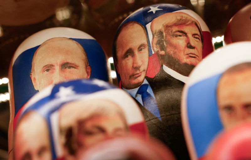 Russian traditional nesting dolls, known as Matryoshkas, with images of Russian President Vladimir Putin and U.S. President Donald Trump are placed on a shelf during a demonstration at a gift shop in central Moscow, Russia, August 12, 2025. REUTERS/Yulia Morozova