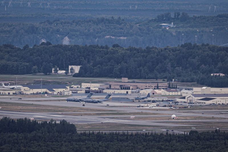 Aircrafts sit at Joint Base Elmendorf-Richardson ahead of a planned meeting between U.S. President Donald Trump and Russian President Vladimir Putin to discuss the war in Ukraine, in Anchorage, Alaska, U.S., August 13, 2025. REUTERS/Jeenah Moon