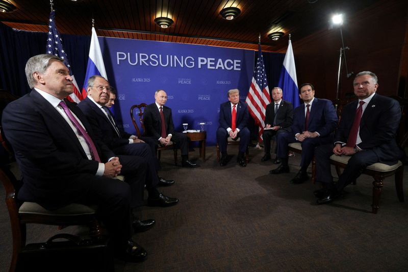 Russian President Vladimir Putin and U.S. President Donald Trump attend a meeting, as Russian Presidential Aide Yury Ushakov, Russian Foreign Minister Sergey Lavrov, U.S. Secretary of State Marco Rubio and U.S. Special Envoy Steve Witkoff sit nearby, at Joint Base Elmendorf-Richardson in Anchorage, Alaska, U.S., August 15, 2025. Sputnik/Gavriil Grigorov/Pool via REUTERS