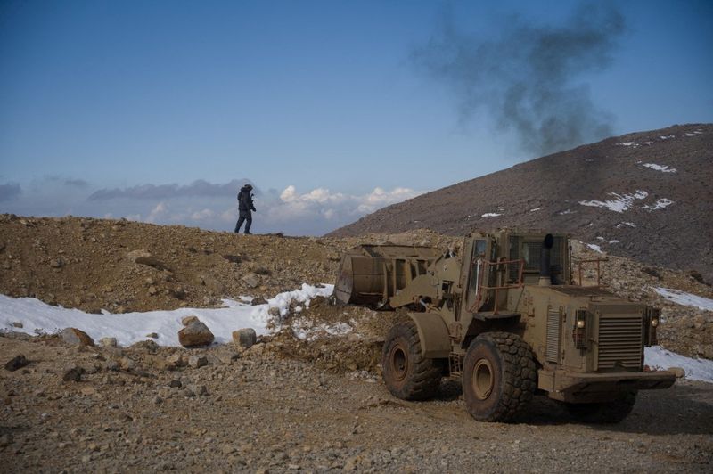 FILE PHOTO: Israeli forces operate at a location given as Mount Hermon region, Syria, in this handout image released December 9, 2024.  Israel Defense Forces/Handout via REUTERS/File Photo