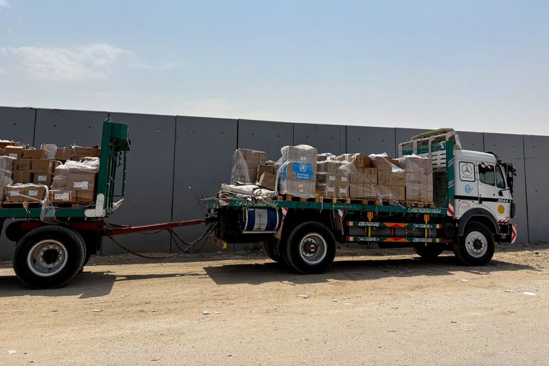 FILE PHOTO: A truck carrying humanitarian aid from the World Health Organization stands near the Rafah border crossing between Egypt and the Gaza Strip, in Rafah, Egypt, August 11, 2025. REUTERS/Alexander Dziadosz/File Photo