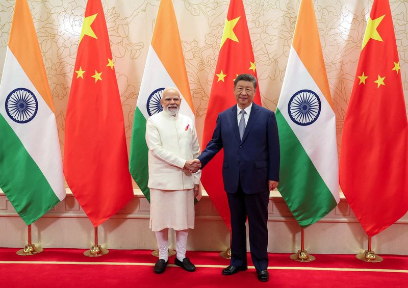 India's Prime Minister Narendra Modi shakes hands with Chinese President Xi Jinping during a meeting on the sidelines of Shanghai Cooperation Organisation (SCO) Summit in Tianjin, China, August 31, 2025. India's Press Information Bureau/Handout via REUTERS