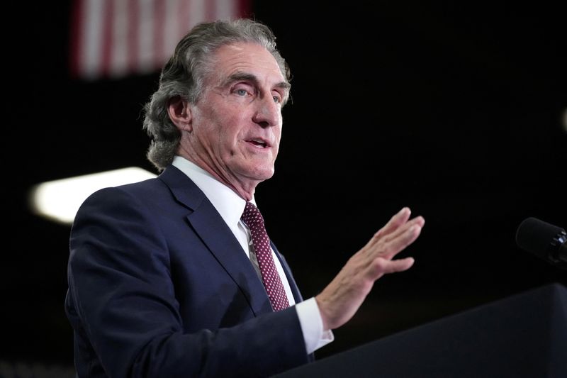 Secretary of the Interior Doug Burgum introduces U.S. Vice President JD Vance at Mid-City Steel where Vance is expected to promote the The One, Big, Beautiful Bill Act of 2025 passed earlier this summer, the Trump administration's signature piece of legislation, in La Crosse, Wisconsin, U.S., August 28, 2025.    Andrew Harnik/Pool via REUTERS