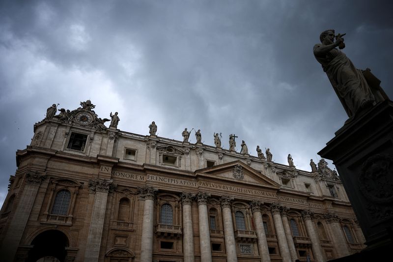 FILE PHOTO: A view of the statue of Saint Peter and St. Peter's Basilica on the day of a weekly general audience, at the Vatican, September 24, 2025. REUTERS/Guglielmo Mangiapane/File Photo