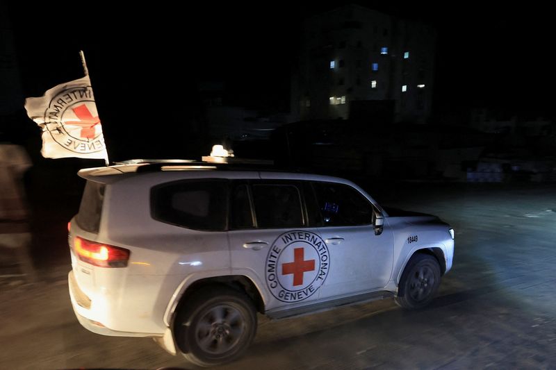 Red Cross transports the body of a deceased hostage, who had been held in Gaza since the deadly October 7, 2023, attack, after it was handed over by Hamas militants as part of a ceasefire and a hostages-prisoners swap deal between Hamas and Israel, in Gaza City, October 27, 2025. REUTERS/Dawoud Abu Alkas