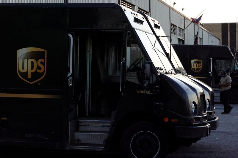 FILE PHOTO: United Parcel Service (UPS) vehicles are seen at a facility in Brooklyn, New York City, U.S., May 9, 2022. REUTERS/Andrew Kelly/File Photo