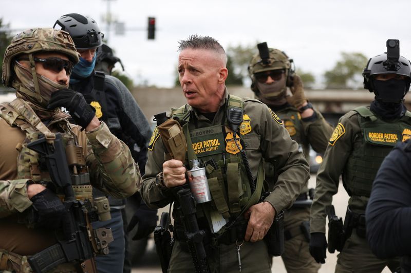 USBP Chief Patrol Agent of the El Centro sector, Greg Bovino, speaks with federal agents in the Cicero neighborhood during an immigration raid, after U.S. President Donald Trump ordered increased federal law enforcement presence to assist in crime prevention, in Chicago, Illinois, U.S., October 22, 2025. REUTERS/Jim Vondruska