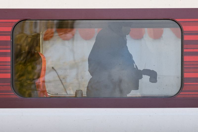 A forensic officer inspects the London North Eastern Railway (LNER) train where a series of stabbings took place, at a platform at Huntingdon Station, near Cambridge, Britain, November 2, 2025. REUTERS/Jack Taylor