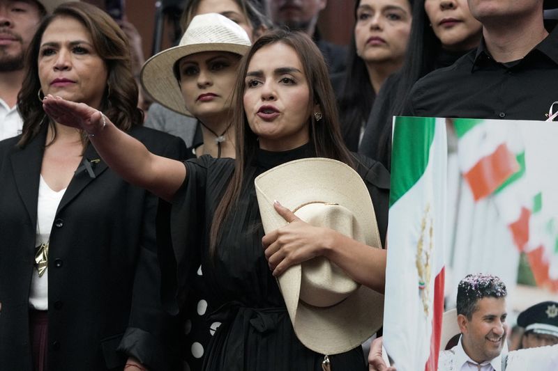Grecia Quiroz is sworn in as mayor of Uruapan, Mexico's avocado capital, after the state congress unanimously approved her appointment to replace her husband, Carlos Manzo, who was killed during Day of the Dead celebrations, in Morelia, Mexico, November 5, 2025. REUTERS/Ivan Arias