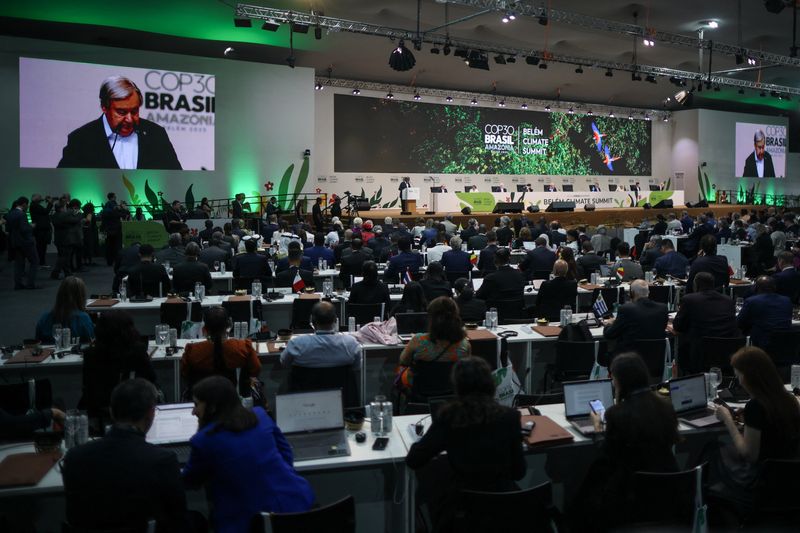 United Nations Secretary-General Antonio Guterres appears on screens as he speaks at the opening of the Belem Climate Summit plenary session, as part of the United Nations Climate Change Conference (COP30), in Belem, Brazil, November 6, 2025. REUTERS/Adriano Machado