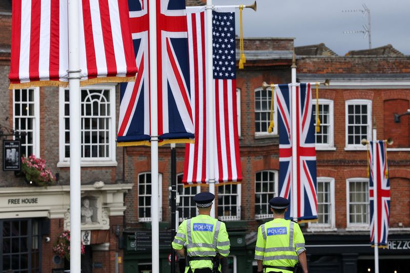 Police officers patrol as ceremonial U.S. and Union Jack flags hang during U.S. President Donald Trump and first lady Melania Trump's state visit, in Windsor, Britain, September 18, 2025. REUTERS/Toby Melville
