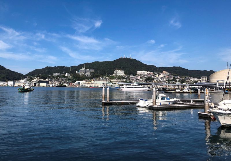 A general view shows Nagasaki port, which was among the few gateways to the outside world during Japan’s two-century national isolation policy that lasted until around 1850, amid the coronavirus disease (COVID-19) outbreak in Nagasaki, southwestern Japan September 29, 2020. Picture taken September 29, 2020. REUTERS/Leika Kihara