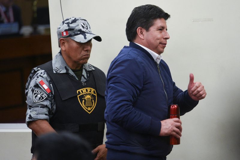 Peru’s former leftist President Pedro Castillo gestures at a court hearing during his trial for rebellion and conspiracy against the state, following his failed attempt to dissolve Congress and assume broad powers in late 2022, in Lima, Peru, November 27, 2025. REUTERS/Luis Julian