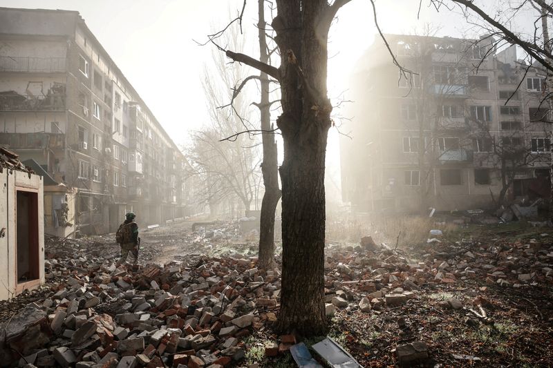 FILE PHOTO: A Ukrainian serviceman walks near apartment buildings damaged by a Russian military strike, amid Russia's attack on Ukraine, in the frontline town of Kostiantynivka in Donetsk region, Ukraine November 15, 2025. Oleg Petrasiuk/Press Service of the 24th King Danylo Separate Mechanized Brigade of the Ukrainian Armed Forces/Handout via REUTERS/File Photo