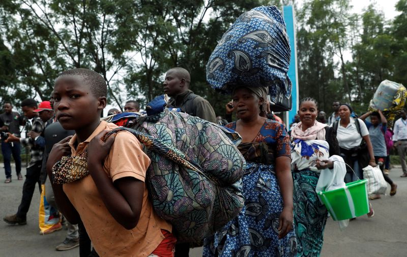 FILE PHOTO: Congolese civilians who fled from Goma, eastern Democratic Republic of Congo following fighting between M23 rebels and the Armed Forces of the Democratic Republic of the Congo (FARDC), arrive at the border-post as they are received by Rwandan authorities in Gisenyi, Rubavu district, Rwanda, January 28, 2025. REUTERS/Thomas Mukoya/File Photo