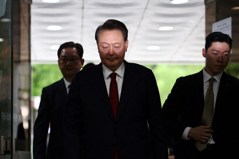 FILE PHOTO: Former South Korean President Yoon Suk Yeol arrives at a court to attend a hearing to review his arrest warrant requested by special prosecutors in Seoul, South Korea, July 9, 2025.   REUTERS/Kim Hong-Ji/Pool     TPX IMAGES OF THE DAY/File Photo