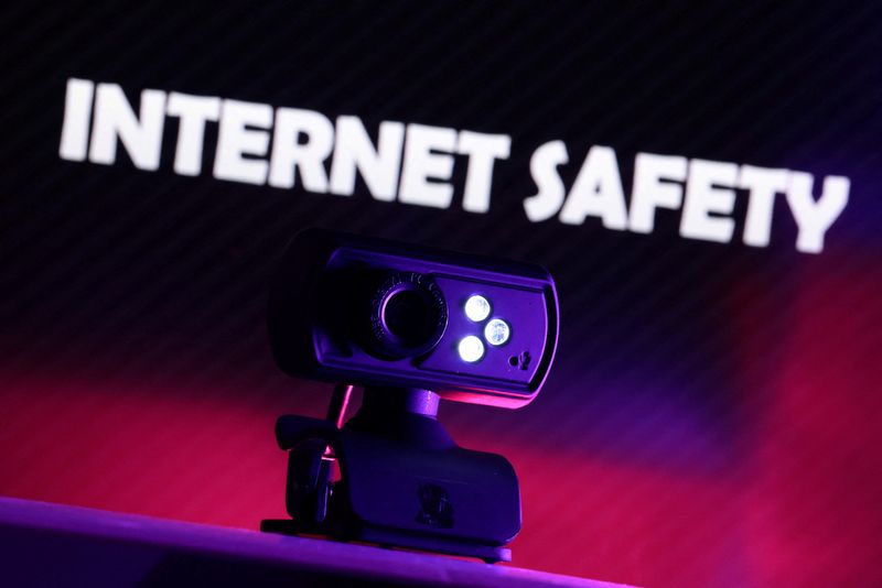 A web camera is seen in front of the displayed words "Internet Safety" in this illustration taken October 21, 2025. REUTERS/Dado Ruvic/Illustration