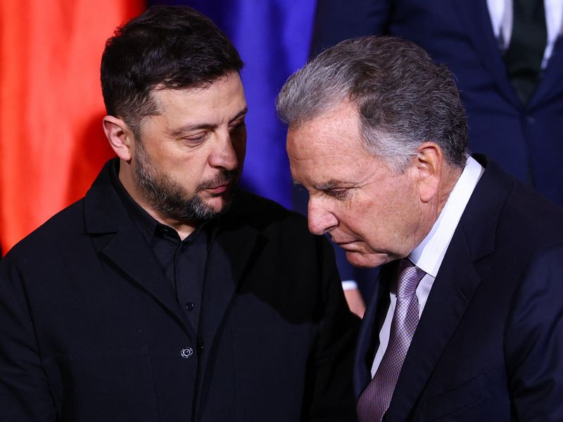 FILE PHOTO: Ukraine's President Volodymyr Zelenskiy and U.S. Special Envoy Steve Witkoff speak as they gather for a family photo at the Chancellery in Berlin, Germany, December 15, 2025.    REUTERS/Lisi Niesner/Pool/ File Photo