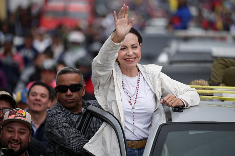 Venezuelan opposition leader Maria Corina Machado greets supporters during a campaign rally for the presidential election, in Merida state, Venezuela June 25, 2024. REUTERS/Gaby Oraa
