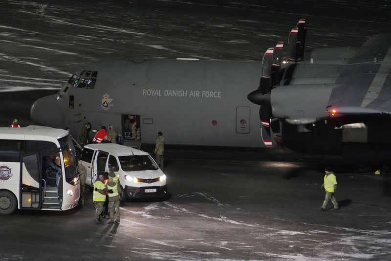 A Royal Danish Air Force plane carrying personnel in military fatigues lands at Nuuk airport Greenland, January 14, 2026. REUTERS/Janis Laizans