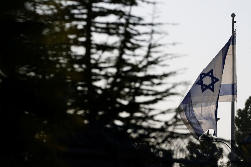 An Israeli flag flies outside the Prime Minister's Office  in Jerusalem, October 22, 2024. REUTERS/Nathan Howard/Pool
