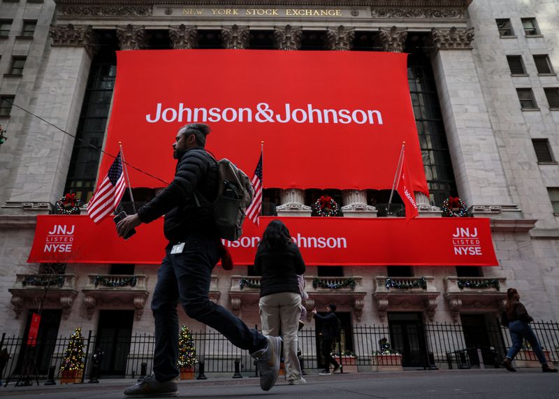 A Johnson & Johnson banner is displayed on the front of the New York Stock Exchange (NYSE) in New York City, in New York City, U.S., December 5, 2023.  REUTERS/Brendan McDermid