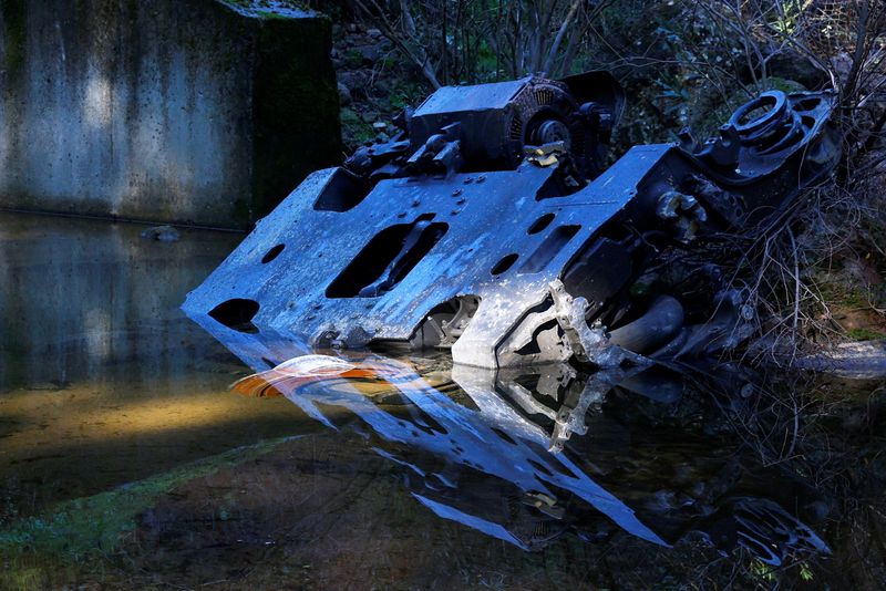 A metal part is seen near the site of a deadly derailment of two high-speed trains near Adamuz, in Cordoba, Spain, January 20, 2026. REUTERS/Susana Vera