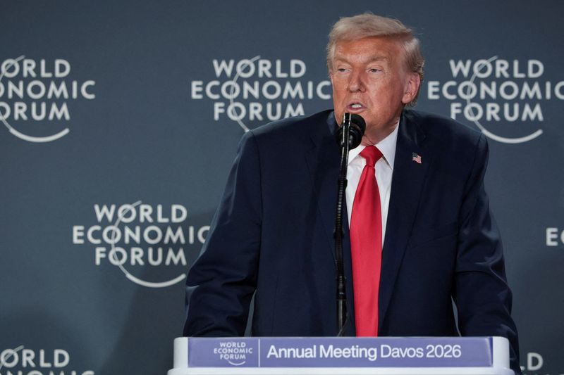 FILE PHOTO: U.S. President Donald Trump speaks during a reception with business leaders at the 56th annual World Economic Forum (WEF), in Davos, Switzerland, January 21, 2026. REUTERS/Jonathan Ernst/File Photo
