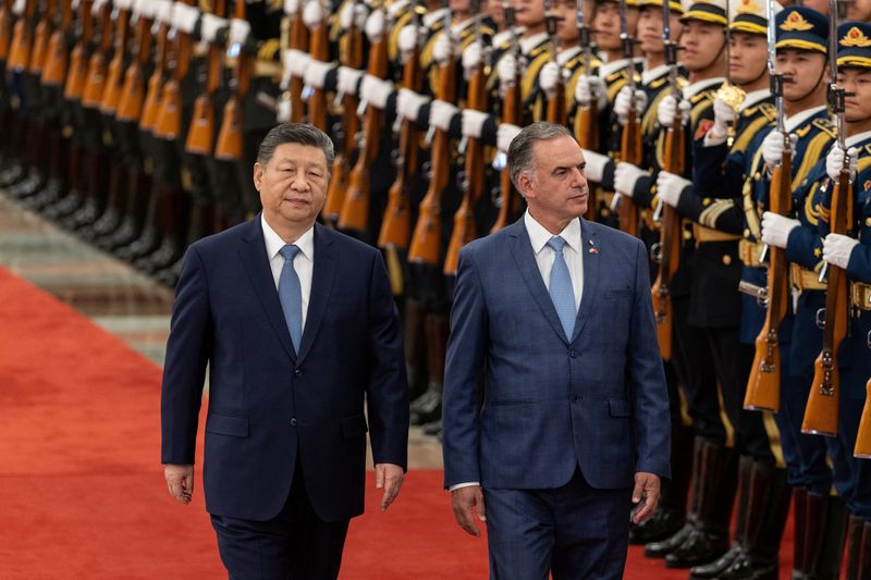 Uruguayan President Yamandu Orsi walks with Chinese President Xi Jinping during a welcome ceremony at the Great Hall of the People in Beijing, China, February 3, 2026. JESSICA LEE/Pool via REUTERS