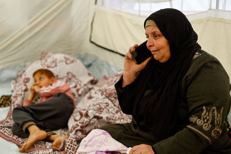 Huda Abu Abed, 56, at a tent shelter after returning to Gaza through the Rafah crossing, in Khan Younis in the southern Gaza Strip, February 3, 2026. REUTERS/Mahmoud Issa