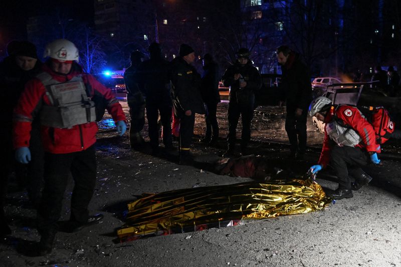 SENSITIVE MATERIAL. THIS IMAGE MAY OFFEND OR DISTURB A member of Red Cross uses a thermal blanket to cover the body of a young woman who was killed by a Russian drone strike, amid Russia's attack on Ukraine, in Zaporizhzhia, Ukraine February 3, 2026. REUTERS/Stringer