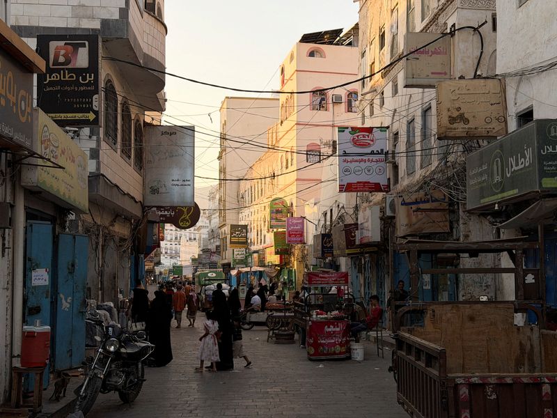 FILE PHOTO: People walk through a traditional market in the port city of Mukalla, Hadramout, Yemen, January 20, 2026. Picture taken with a mobile phone. REUTERS/Hamad I Mohammed/File Photo