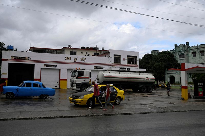 FILE PHOTO: A fuel truck from Cuba's state oil company CUPET refills a gas station, after U.S. President Donald Trump vowed to stop Venezuelan oil and money from reaching the island as Cubans brace for worsening fuel shortages amid regular power outages, in Havana, Cuba January 12, 2026. REUTERS/Norlys Perez/File Photo
