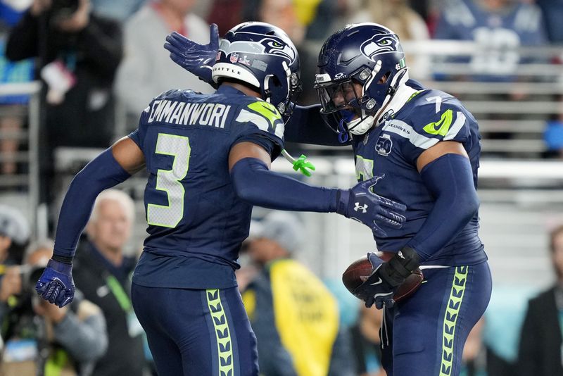 Feb 8, 2026; Santa Clara, CA, USA; Seattle Seahawks linebacker Uchenna Nwosu (7) celebrates with safety Nick Emmanwori (3) after scoring a touchdown against the New England Patriots during the fourth quarter in Super Bowl LX at Levi's Stadium. Mandatory Credit: Kyle Terada-Imagn Images