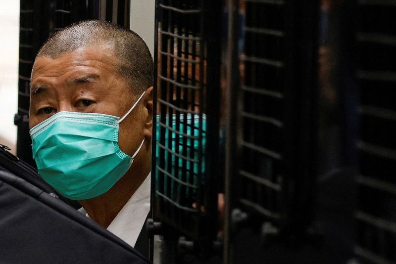 FILE PHOTO: FILE PHOTO: FILE PHOTO: Media mogul Jimmy Lai, founder of Apple Daily, arrives the Court of Final Appeal by prison van in Hong Kong, China February 9, 2021. REUTERS/Tyrone Siu/File Photo/File Photo/File Photo