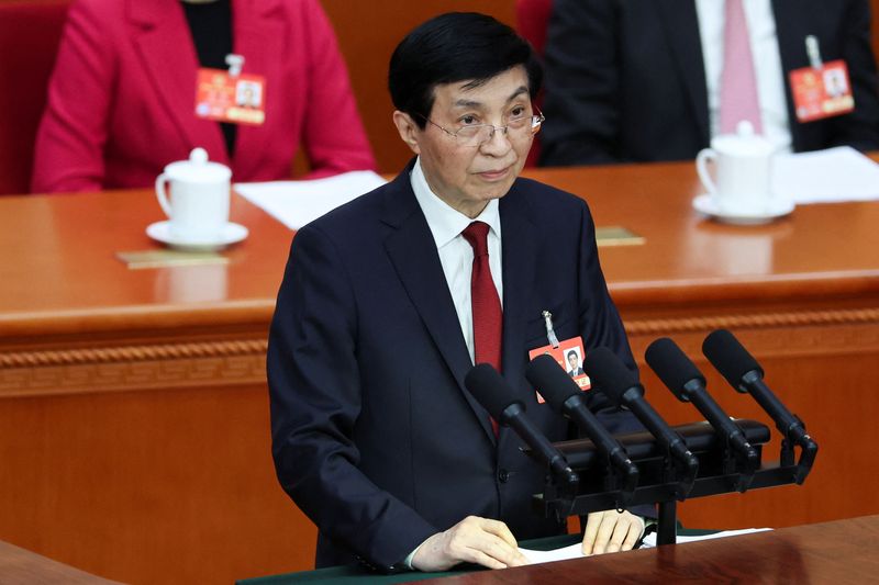 FILE PHOTO: Chinese People's Political Consultative Conference (CPPCC) Chairman Wang Huning speaks at the opening session of the Chinese People's Political Consultative Conference (CPPCC) at the Great Hall of the People in Beijing, China March 4, 2025. REUTERS/Florence Lo/File Photo