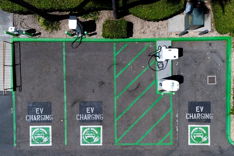 An electric vehicle charging location is shown from the view of a drone in Oceanside, California, U.S., May 14, 2025. REUTERS/Mike Blake