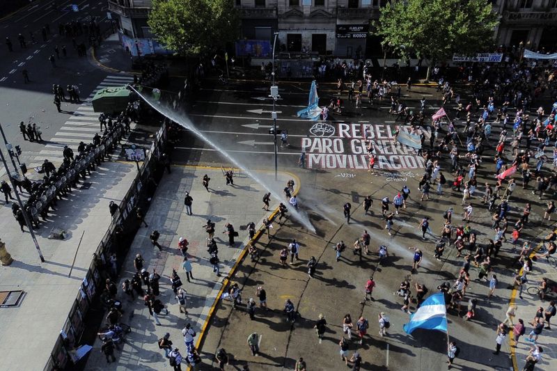 Demonstrators take part in a protest outside Argentina's National Congress on the day lawmakers discuss labor reforms proposed by President Javier Milei's libertarian government to attract investment and revive growth, which unions say would roll back workers' rights, in Buenos Aires, Argentina February 19, 2026. REUTERS/Alessia Maccioni