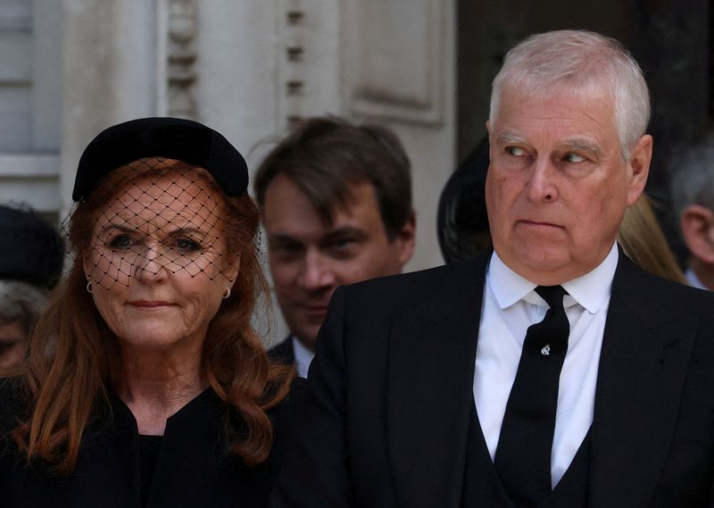 FILE PHOTO: Britain's Prince Andrew and his former wife, Sarah Ferguson, Duchess of York, leave Westminster Cathedral at the end of the Requiem Mass, on the day of the funeral of Britain's Katharine, Duchess of Kent, in London, Britain, September 16, 2025. REUTERS/Toby Melville/File Photo